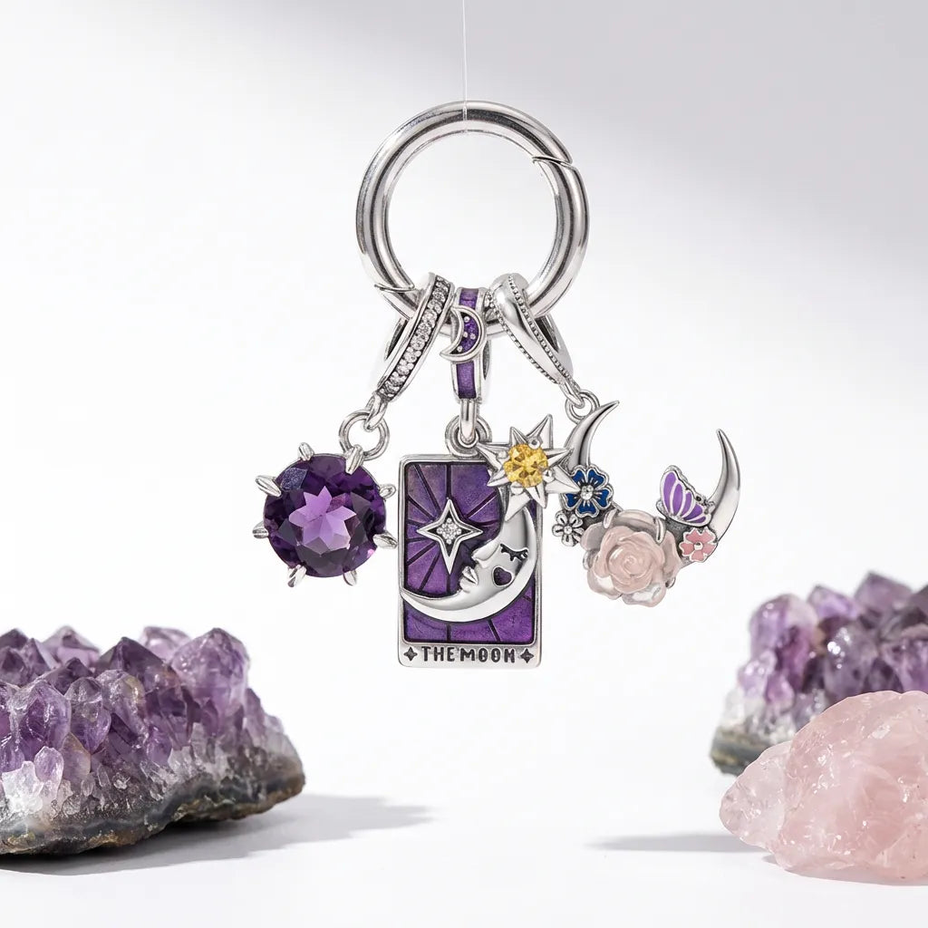 Keychain with celestial-themed charms on a white background