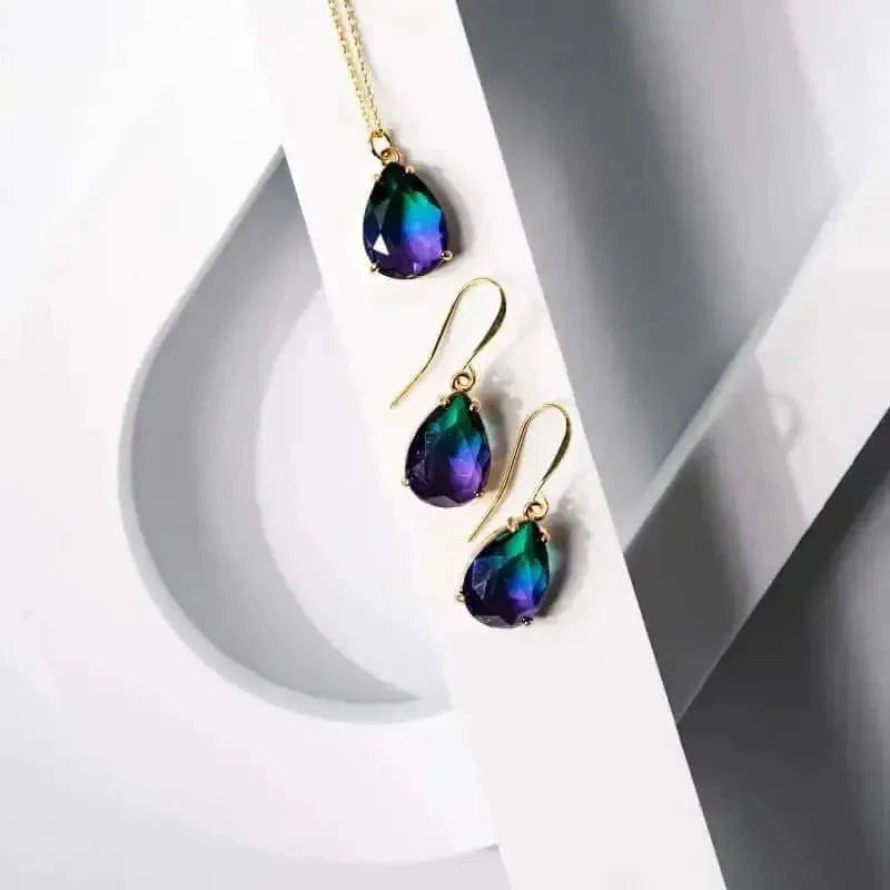 Ombre drop design Peacock Necklace and matching earrings with vibrant purple and green gemstones.