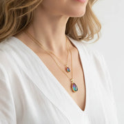 Peacock aura plumeria drop necklaces in gold with purple-green ombre stones