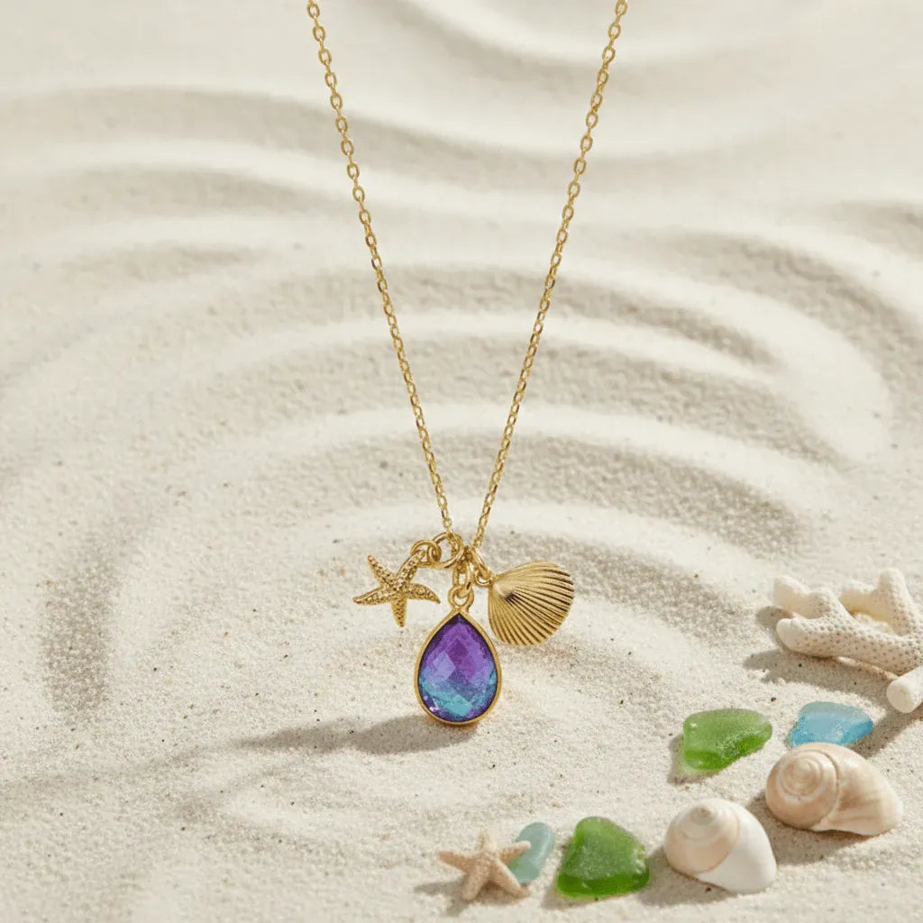 sand background with gold necklace