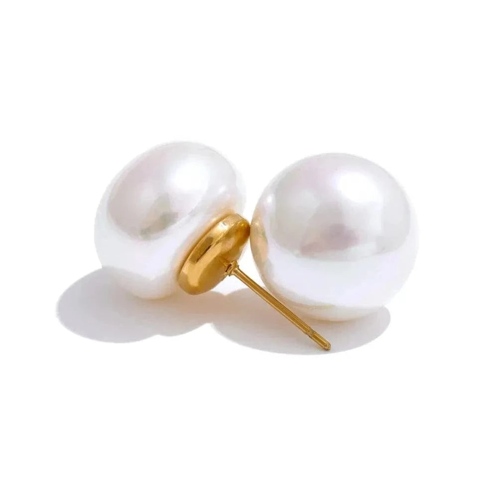 Pearl earring with gold clasp on a white background