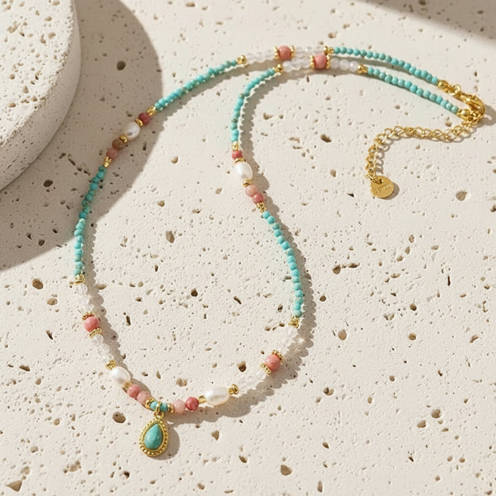 Handmade freshwater pearl and mixed gemstone beaded necklace with gold-set turquoise teardrop pendan 
