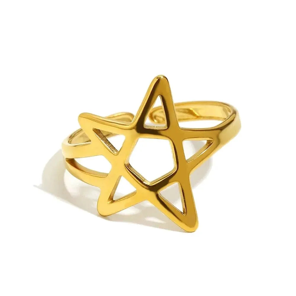 Gold star-shaped ring on a white background