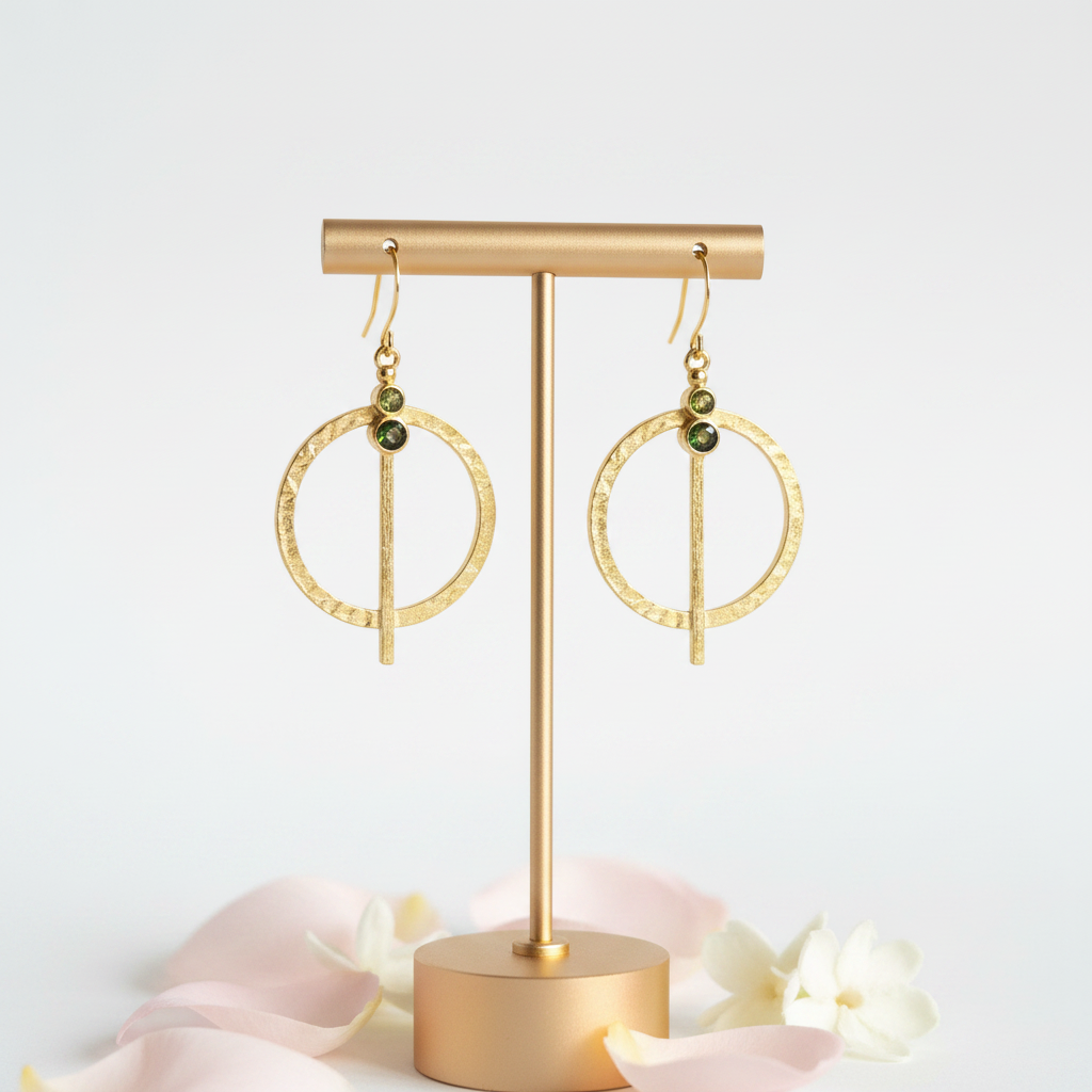 Natural peridot hammered gold medallion earrings hanging — August birthstone jewelry