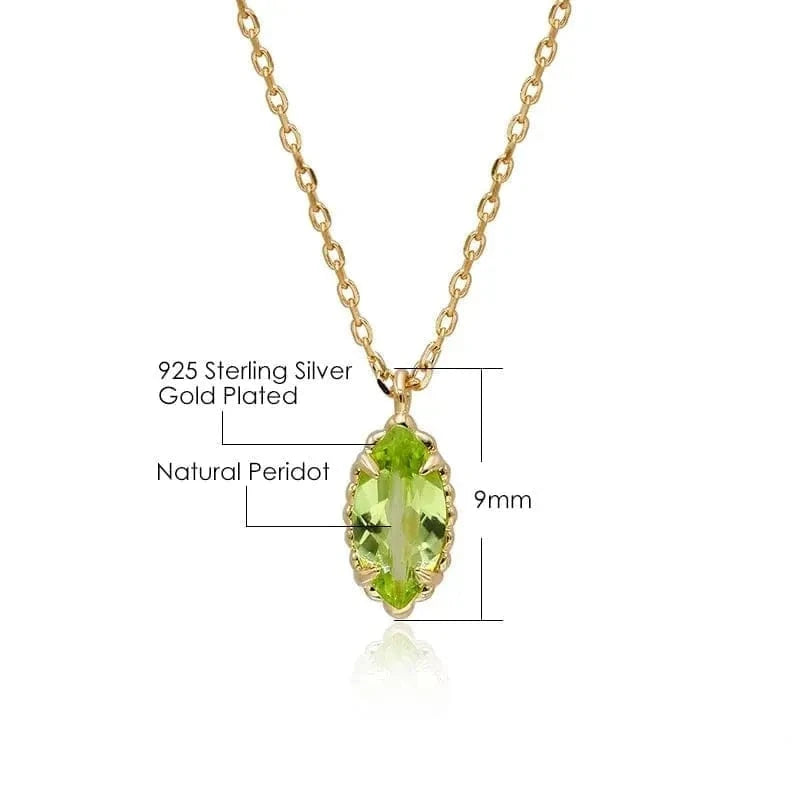 Gold-plated necklace with a green gemstone on a white background