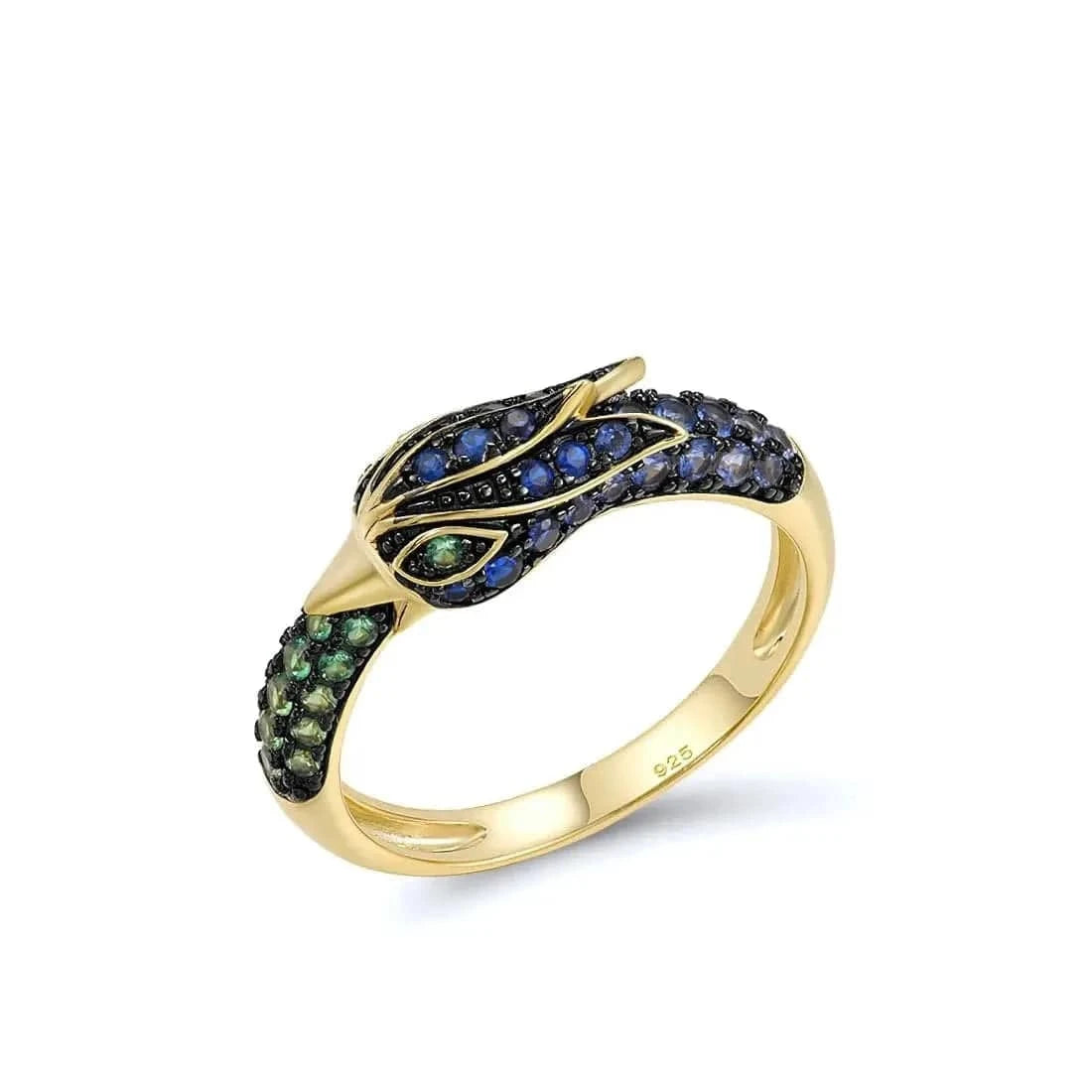 Gold ring with green and blue gemstones on a white background
