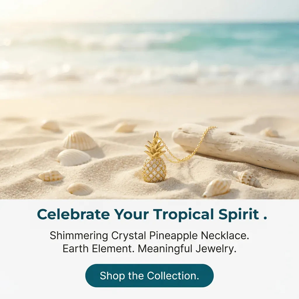 Shimmering crystal pineapple necklace on sand with ocean view, text promoting tropical spirit jewelry.