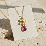 Gold pink plumeria drop necklace on a card — tropical flower necklace for joy