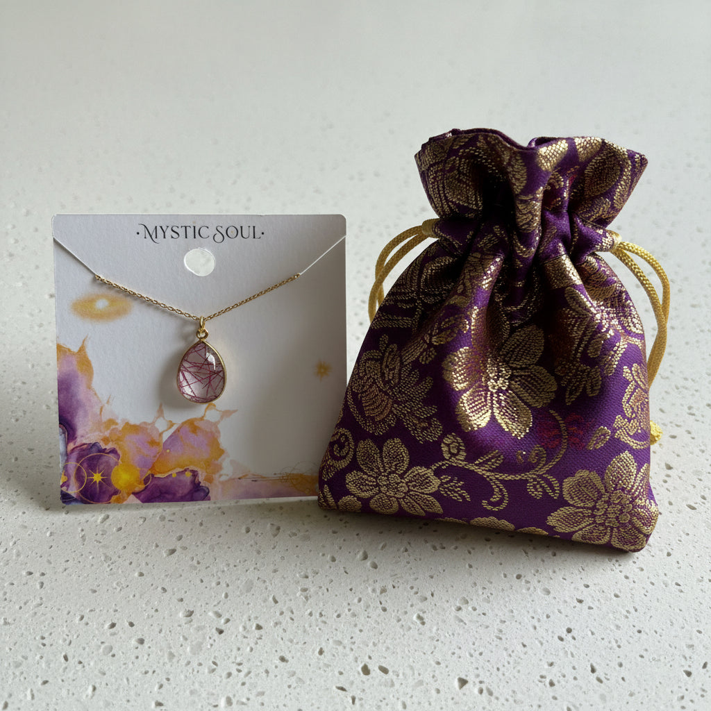 Pink rutilated quartz pendant necklace in gold with Mystic Soul Jewelry gift bag and tag