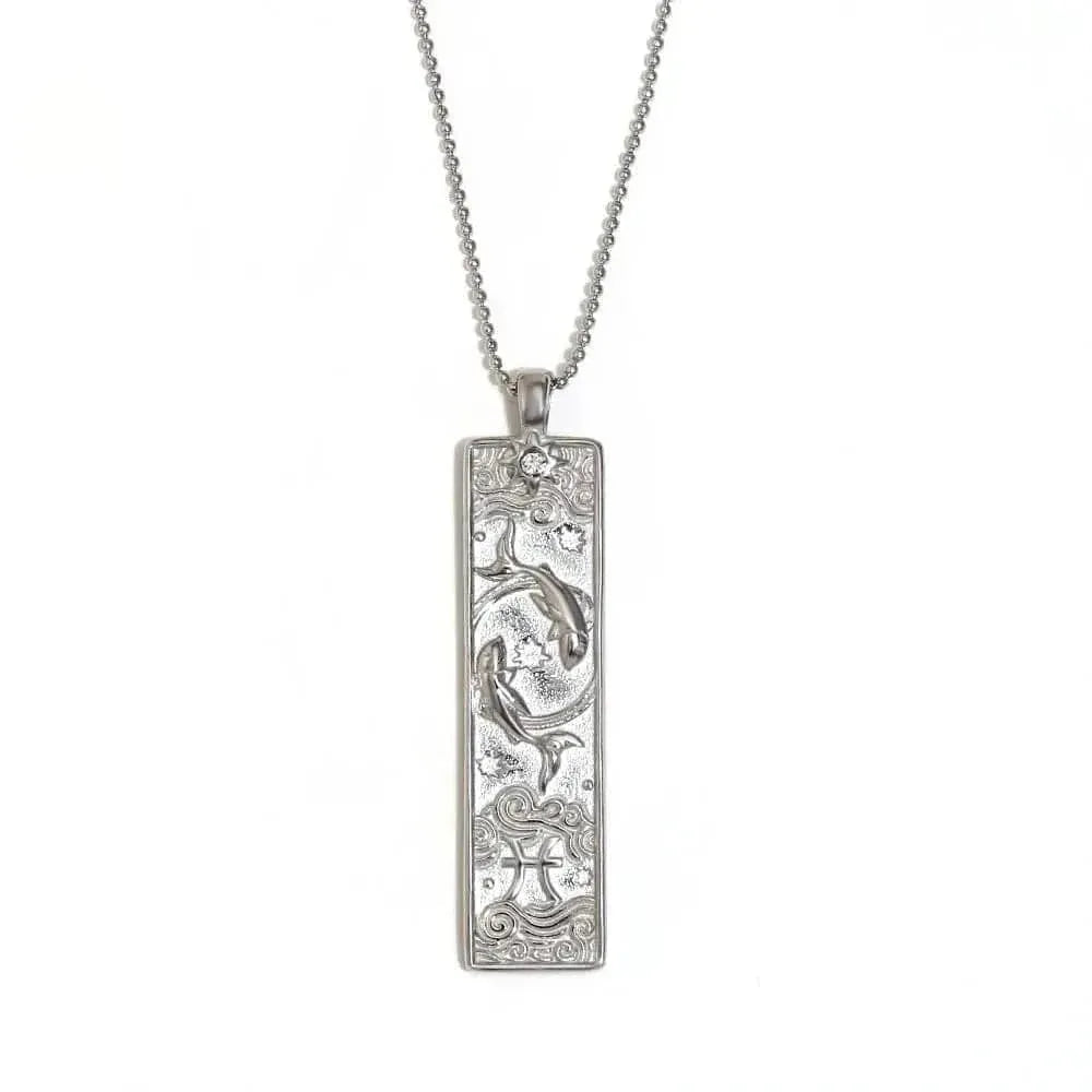 Silver pendant necklace with intricate design on a white background