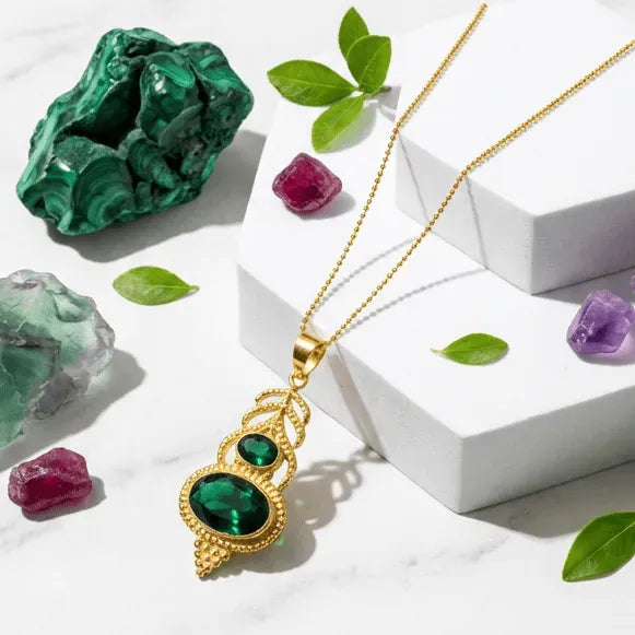 Jewelry set with green gemstones on a white surface with text 'Unlock Your Magic' and 'Heart Chakra Radiance'.