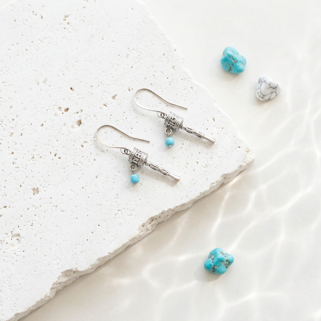 Silver-plated Tibetan prayer wheel drop earrings with turquoise blue beads, meditation jewelry