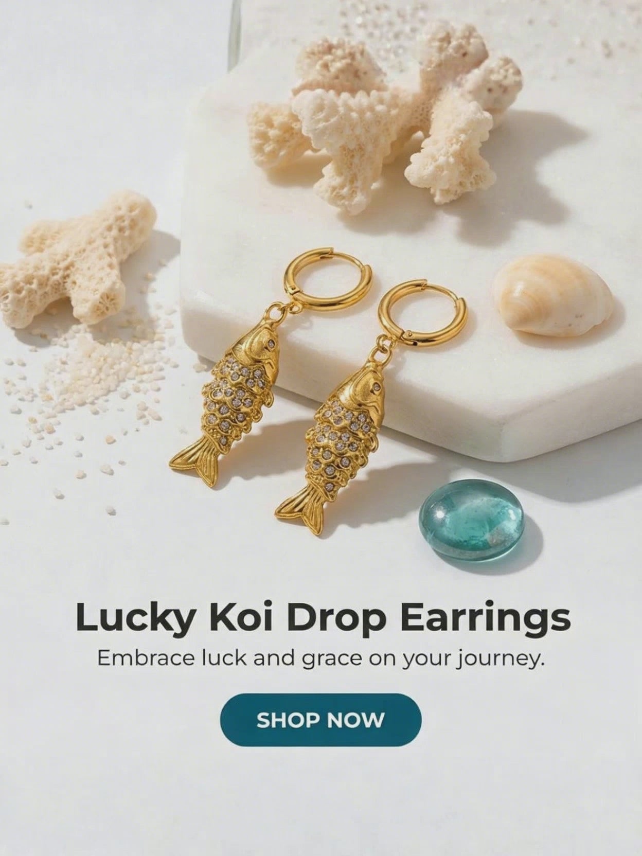 Load video: light background, gold koi fish earrings, coral, shells and water
