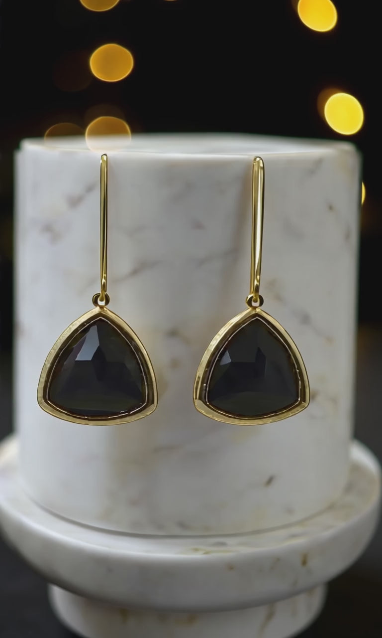 Elegant Black Aria earrings with black stones and gold accents, perfect for making a style statement.