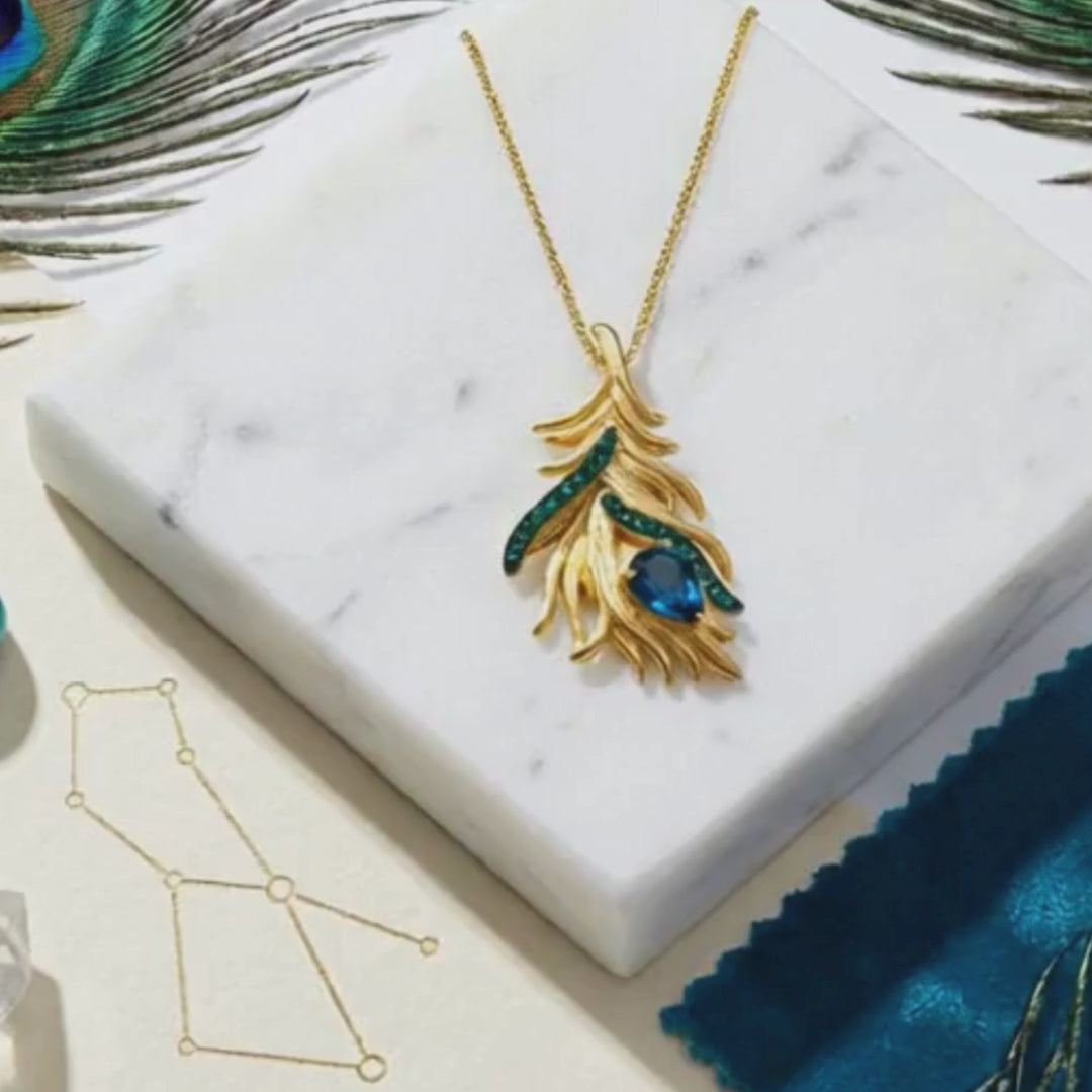Load video: blue topaz feather necklace