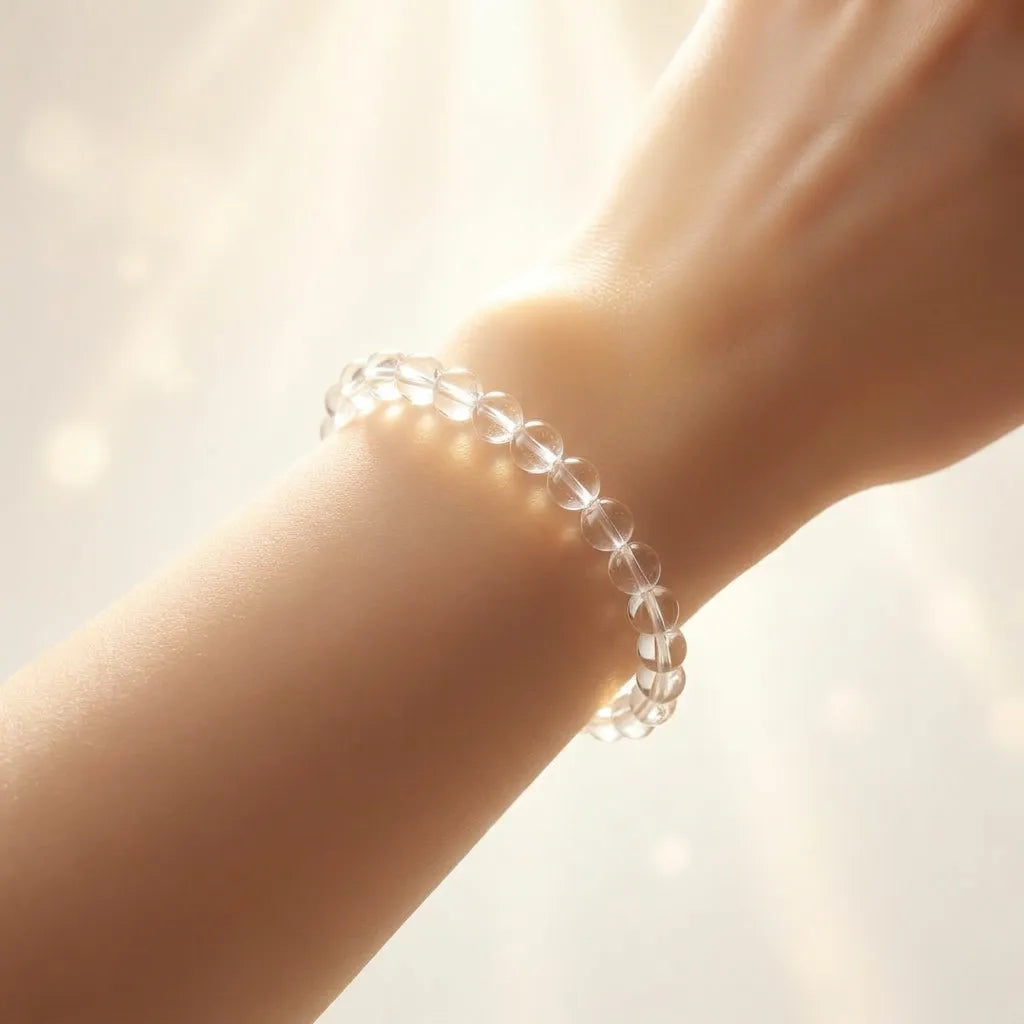 Clear beaded bracelet on a wrist with a soft background