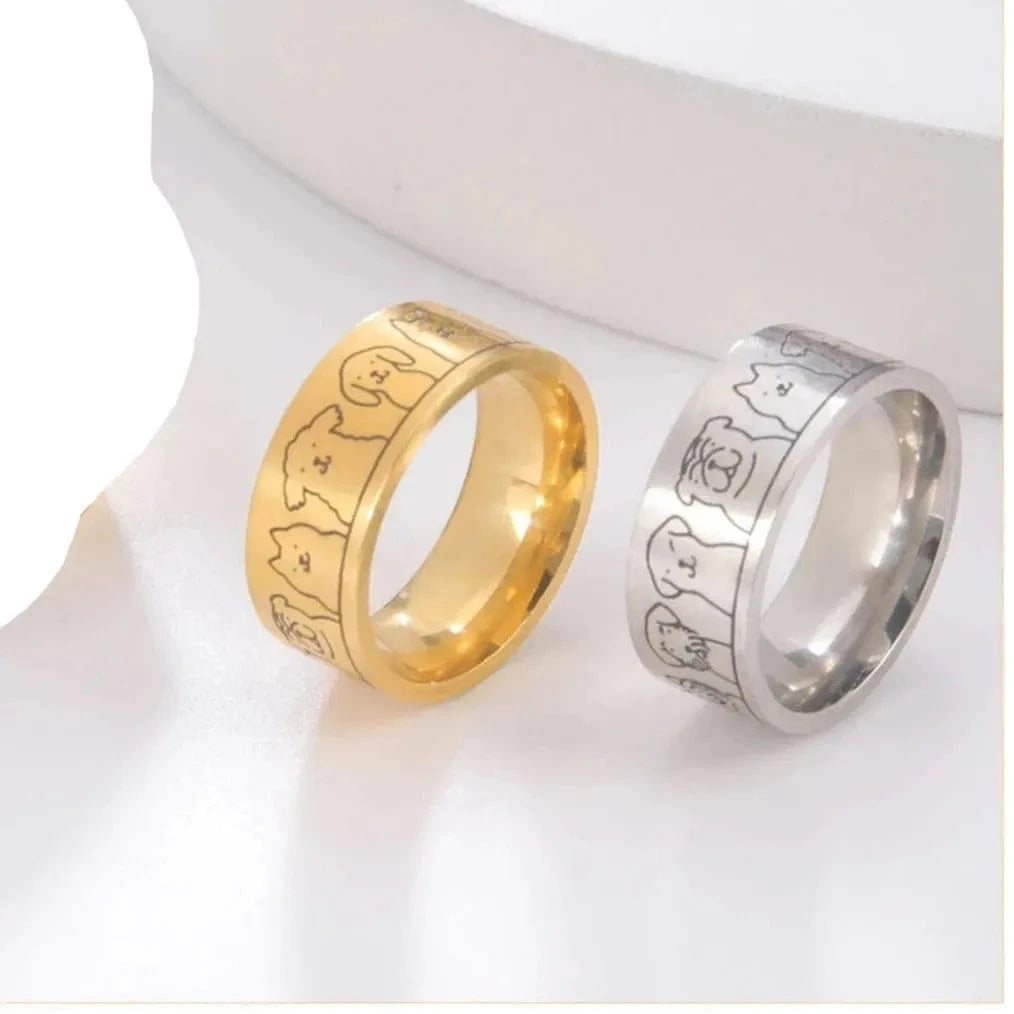 Four rings in gold and silver on a white background