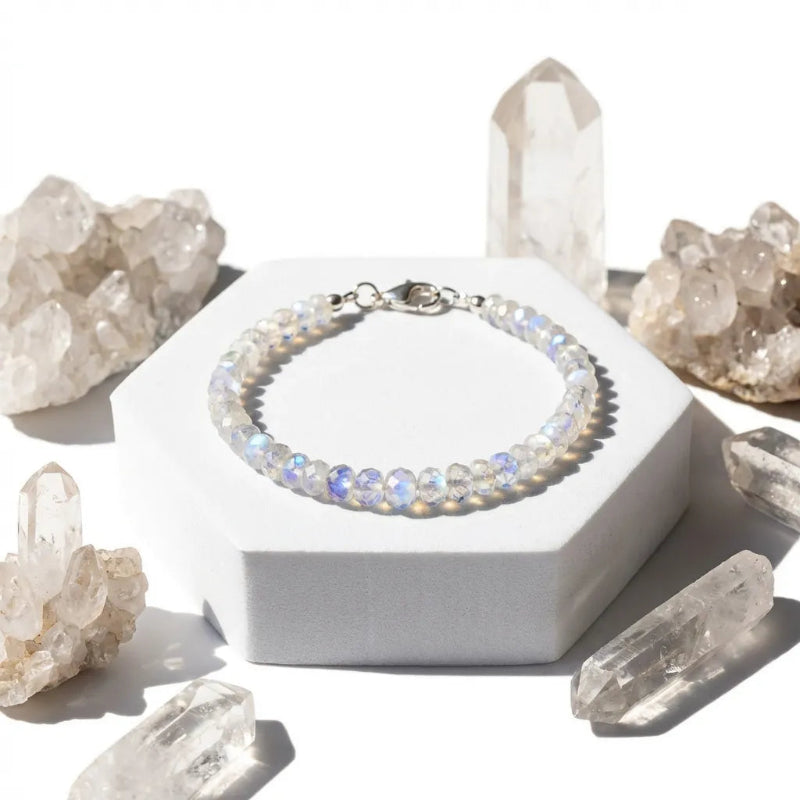 Crystal bracelet on a white stand with crystal formations around it