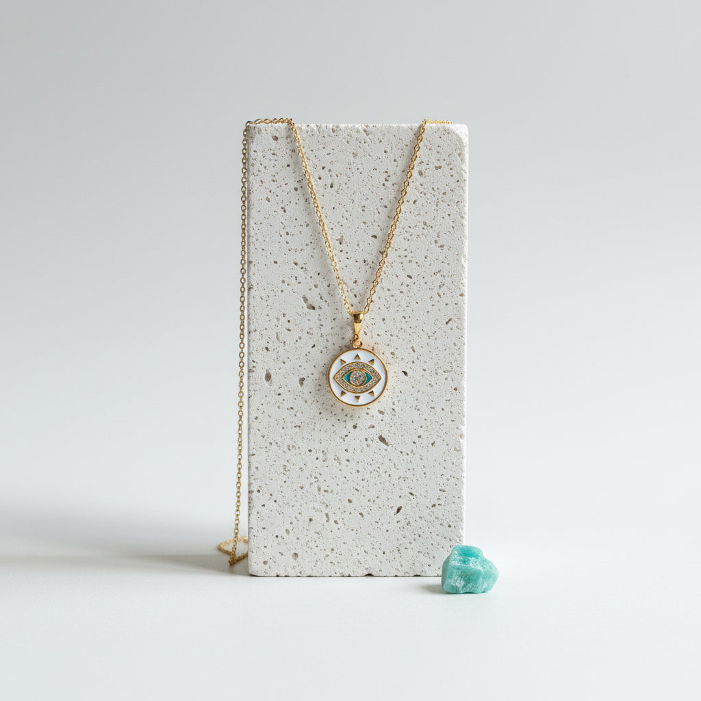 Gold plated third eye medallion necklace with white and turquoise resin face