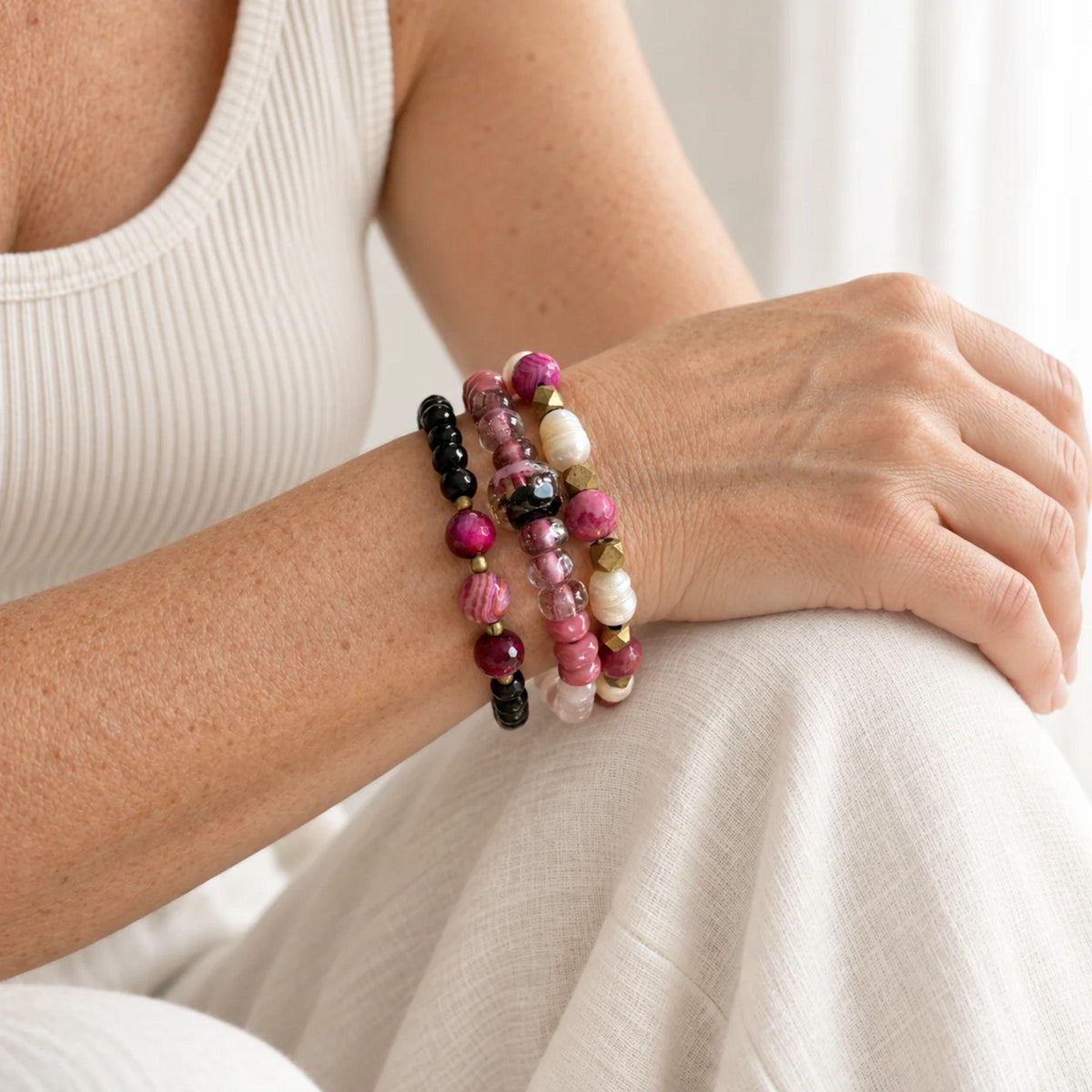 Rose quartz stretch bracelet with Canadian handblown glass rondelles and one dark gold-flecked glass focal