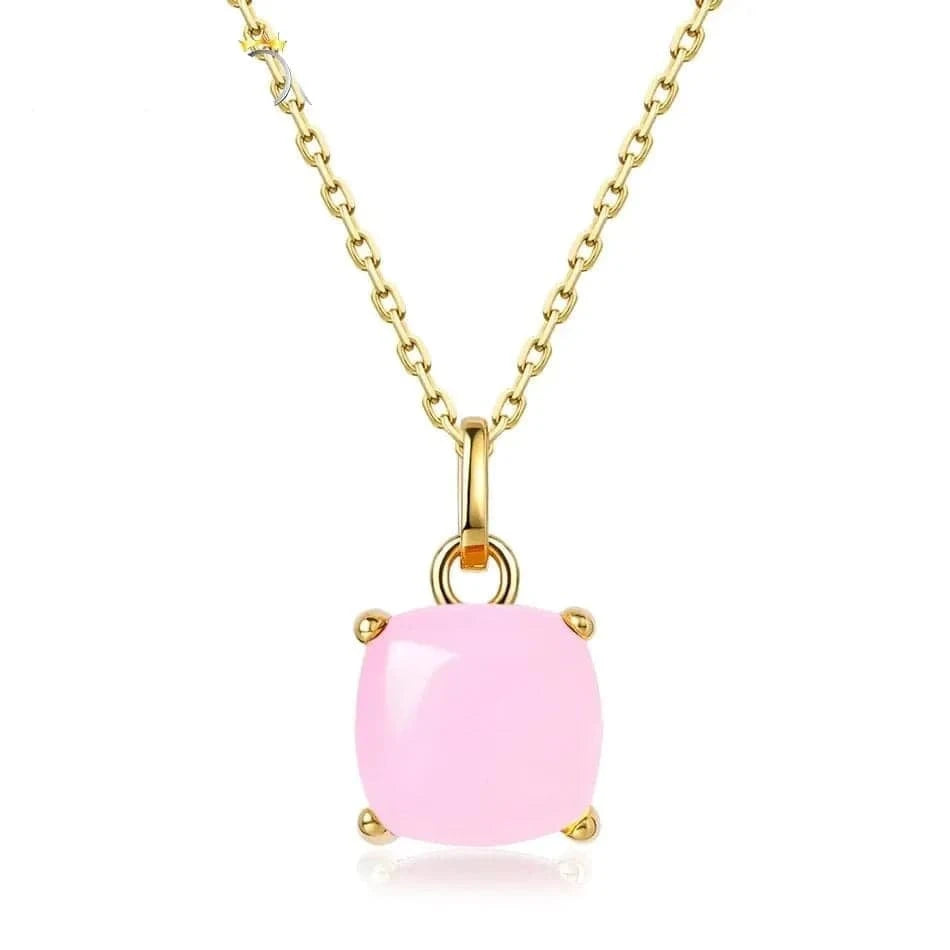 Pink gemstone necklace with gold chain on a white background
