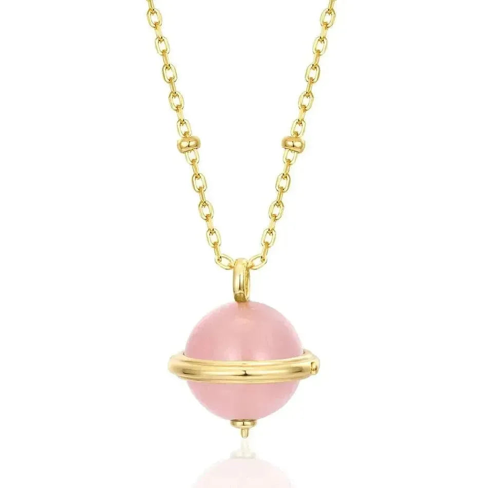 Necklace with a pink bead and gold chain on a white background