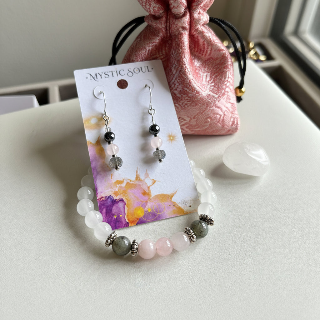 Selenite and rose quartz stretch bracelet shown with matching earrings and Mystic Soul Jewelry tag