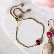 ruby gold bracelet on quartz with rose quartz