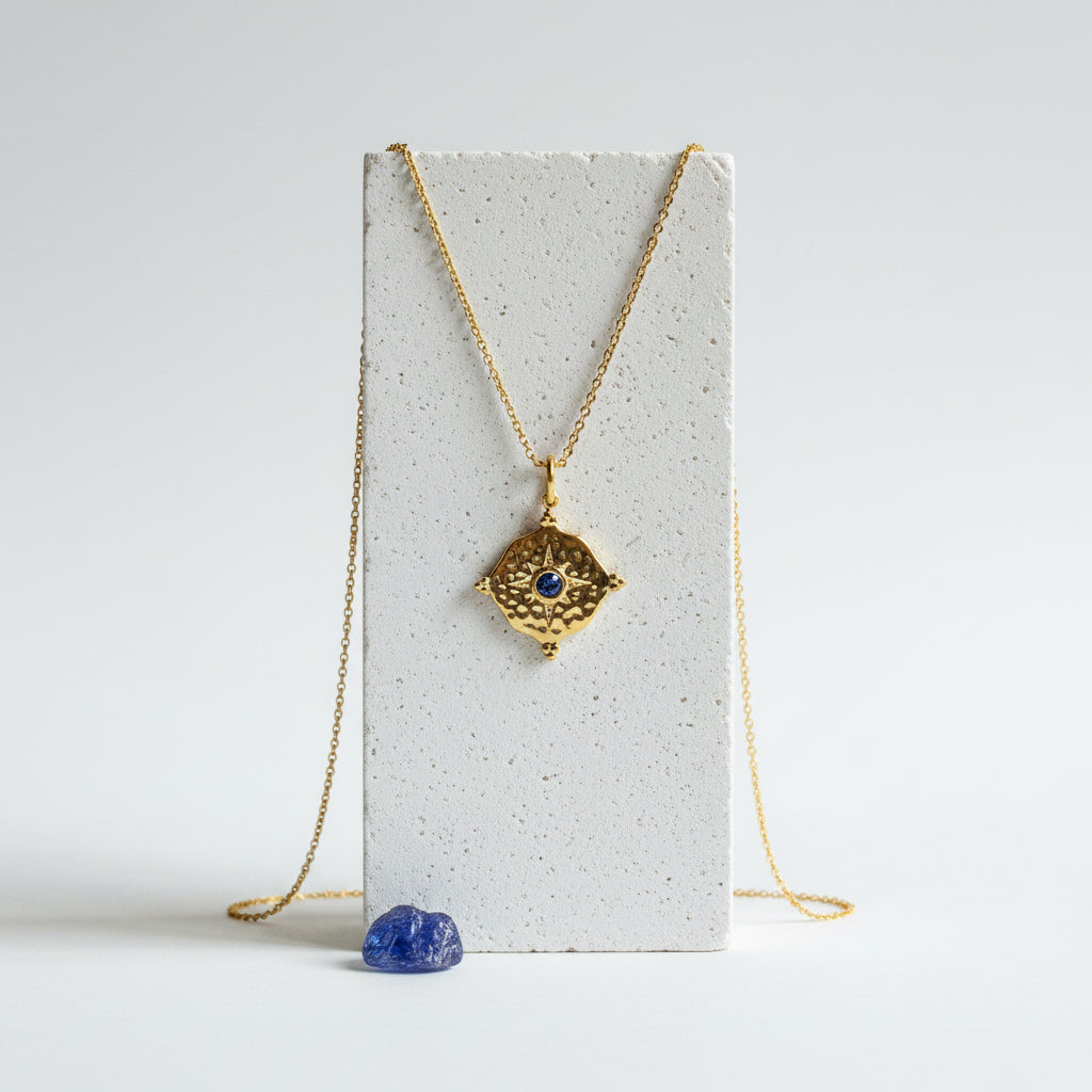 Gold hammered medallion necklace with bright blue sapphire CZ centre, September birthstone jewelry