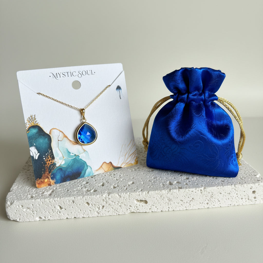 Sapphire Elegant Pebble jewelry in gold with Mystic Soul Jewelry gift bag and tag