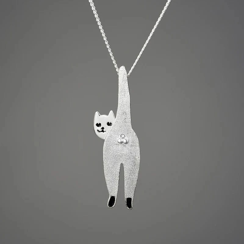 Silver cat-shaped pendant on a chain against a gray background
