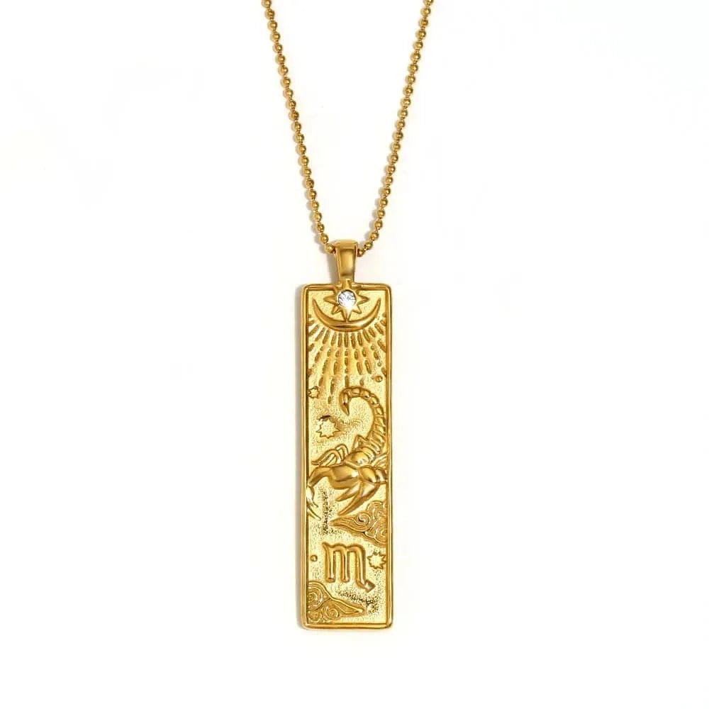 Gold Scorpio zodiac pendant necklace on a white background