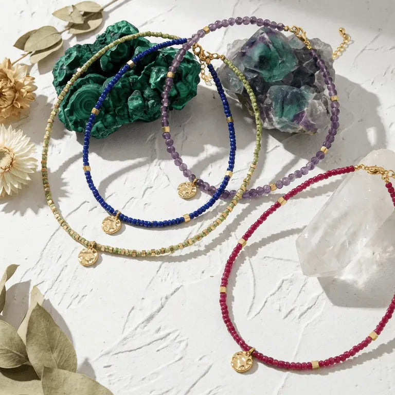 Handcrafted jewelry with gemstones on a textured surface, featuring a question and answer about Mystic Soul Jewelry.