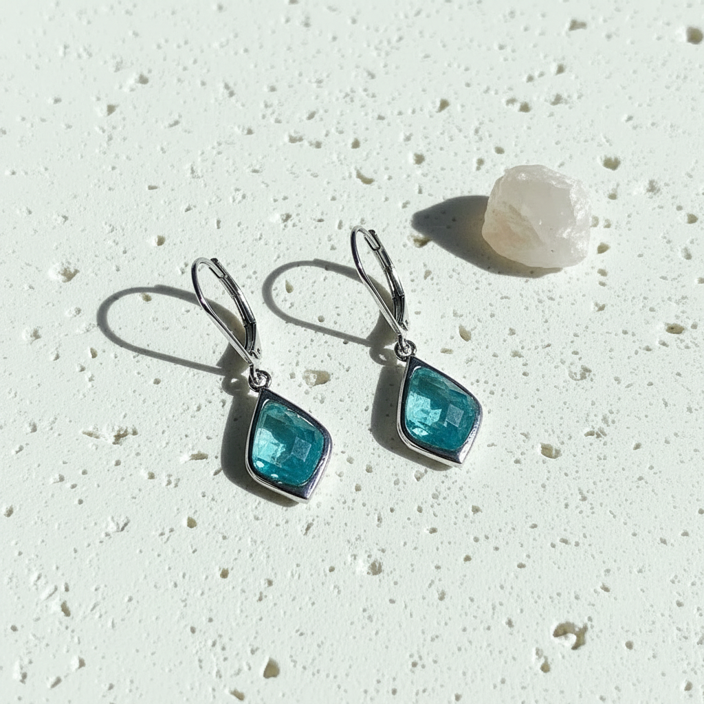 Silver Selene drop earrings with aqua faceted glass