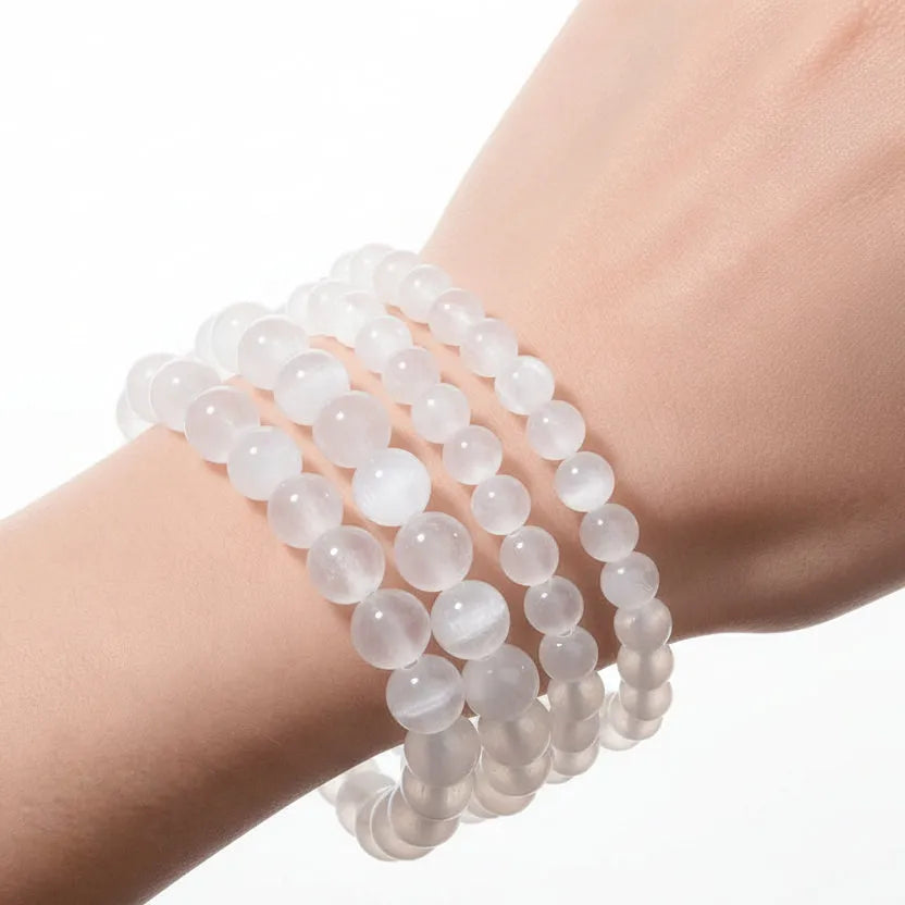 Selenite Crown Chakra stretch bracelet on wrist for cleansing and clarity, sourced by Mystic Soul Jewelry
