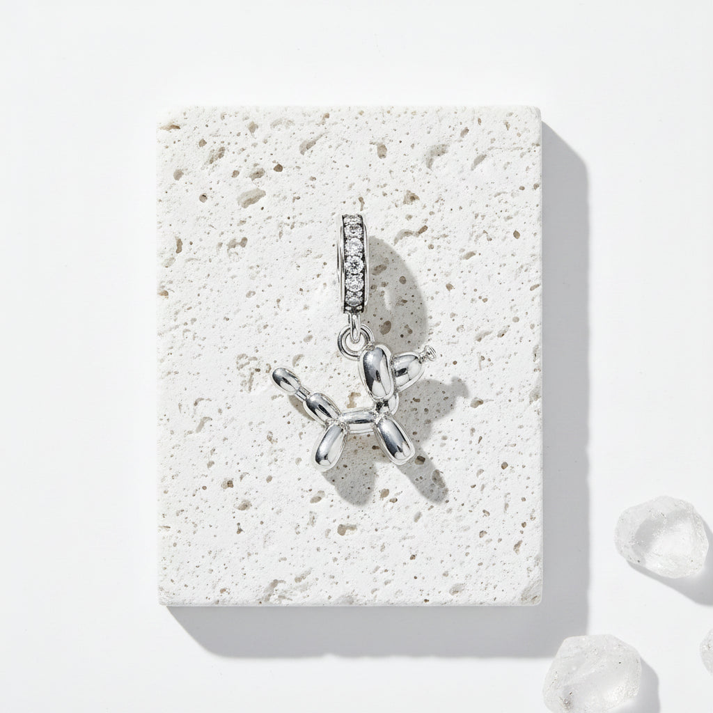 Balloon dog charm pendant in sterling silver with zircon — spirit animal jewellery for loyalty