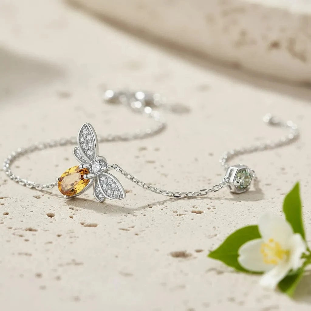 Silver bracelet with gemstones on a light background