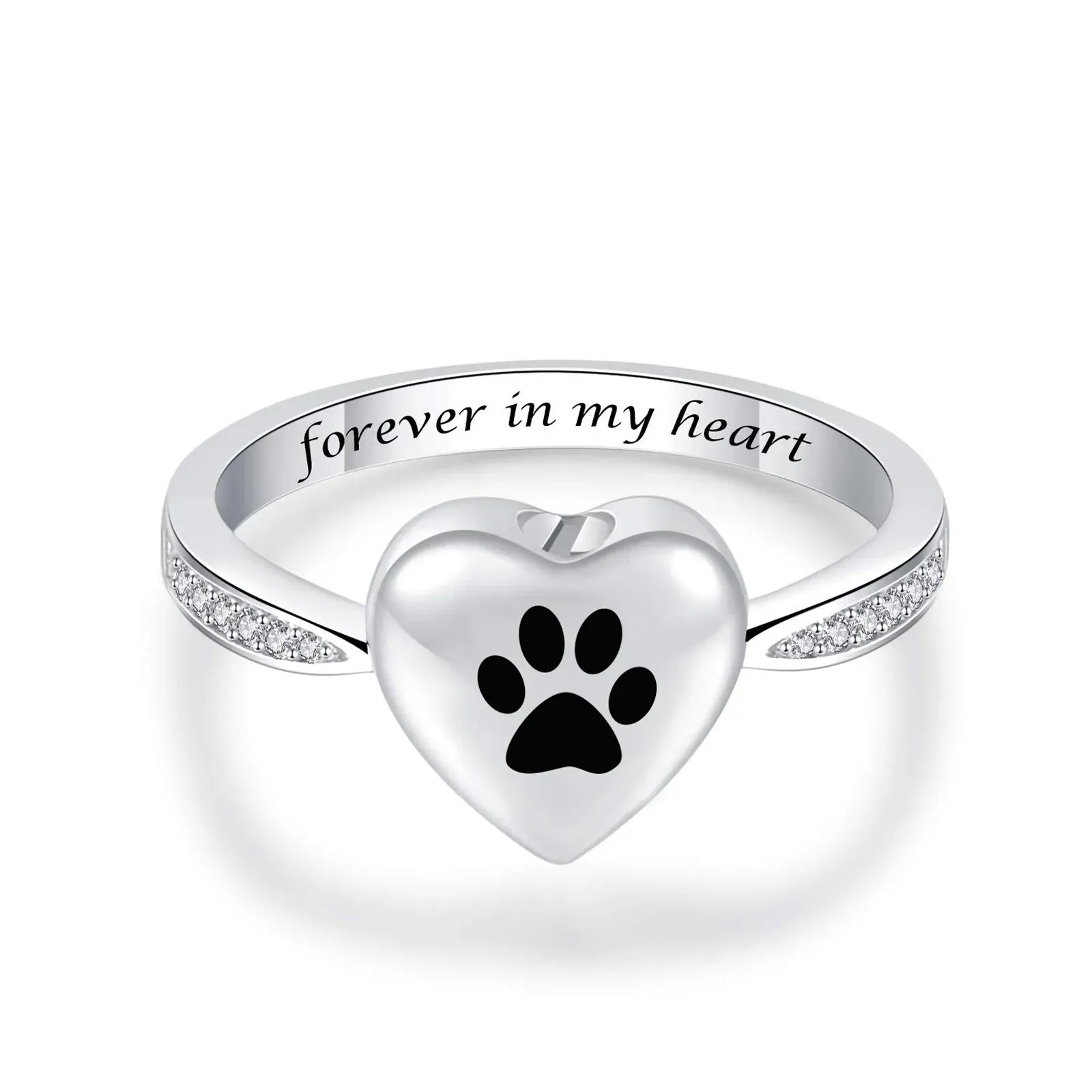 Silver ring with heart-shaped paw print and 'forever in my heart' engraving on a white background