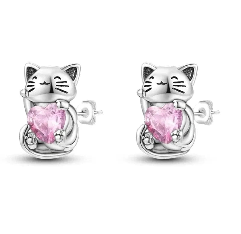 Silver cat-shaped earrings with pink heart stones on a white background