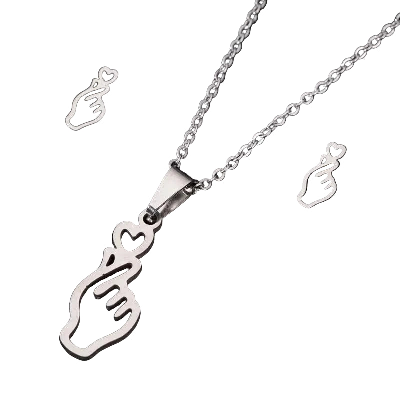 Silver necklace with heart-shaped pendant on a black background