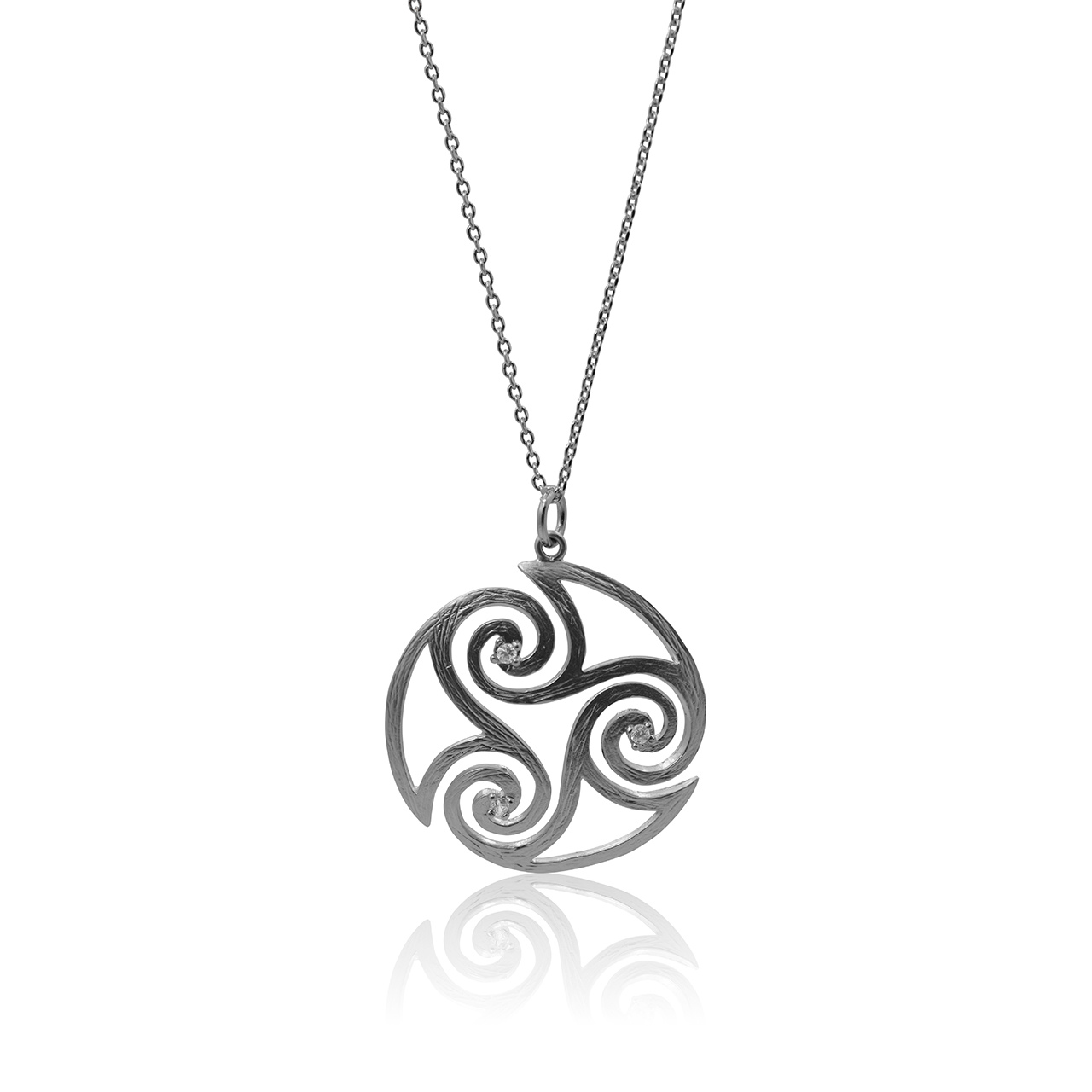 Silver triskele pendant necklace on a white background