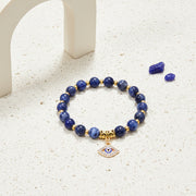 Sodalite evil eye stretch bracelet on natural stone beads — symbol jewellery for protection