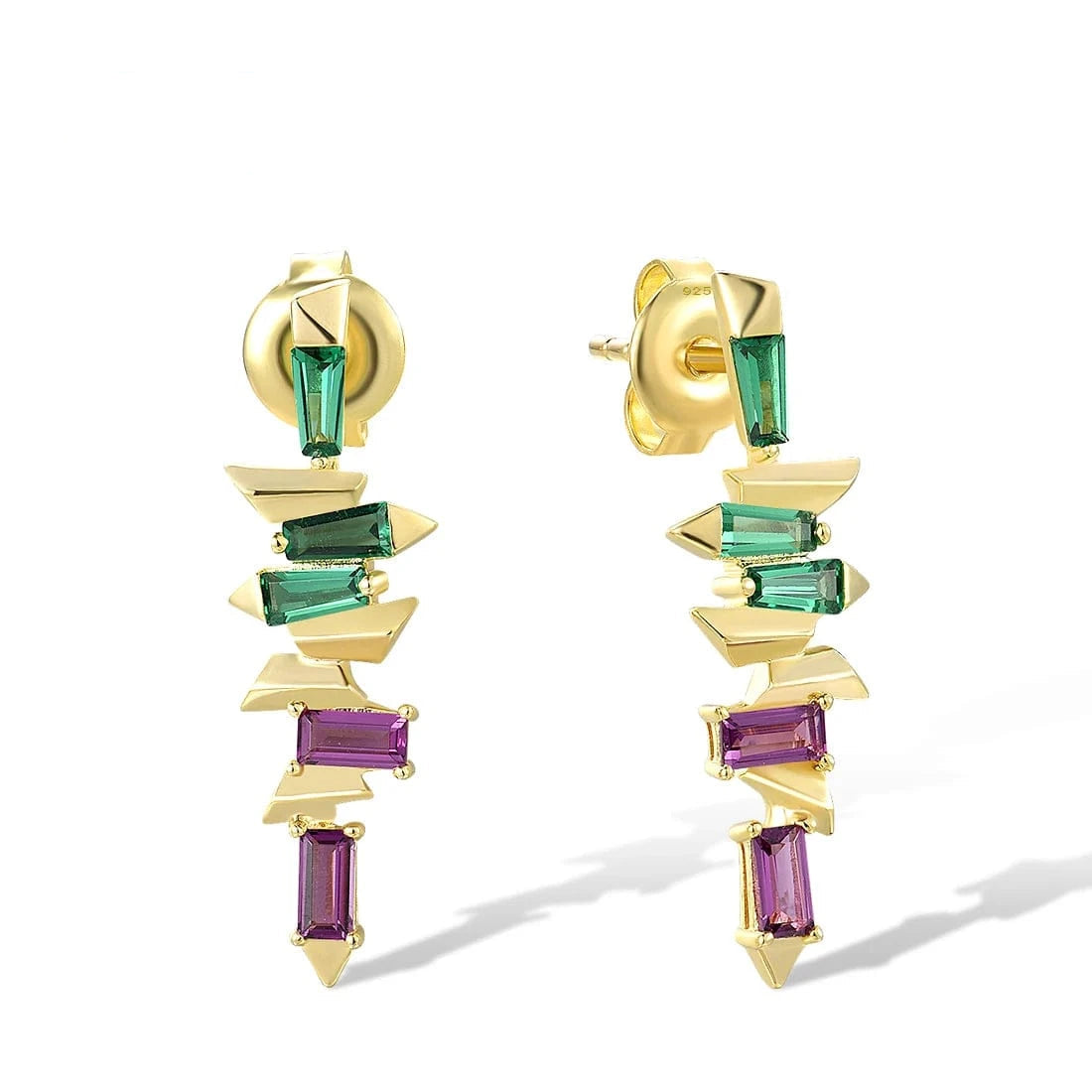 Gold earrings with green and purple gemstones on a white background