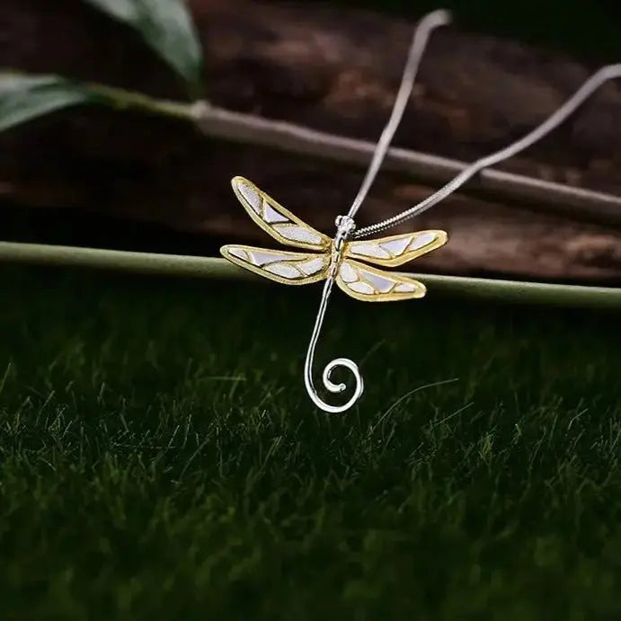 dragonfly necklace on grass