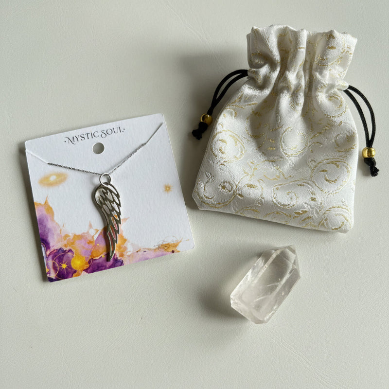 Sterling silver angel wing pendant with Mystic Soul Jewelry gift bag and tag