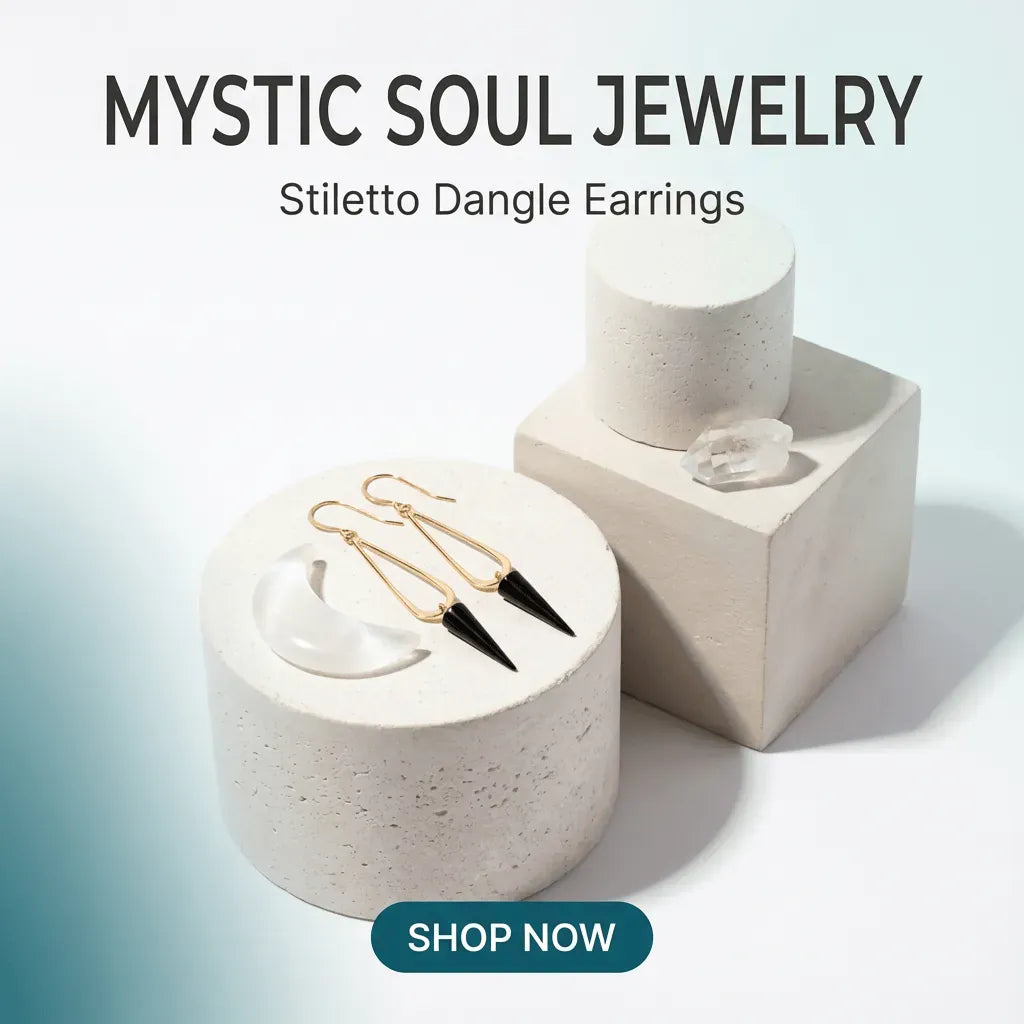 Stiletto dangle earrings on a white pedestal with 'Mystic Soul Jewelry' branding.