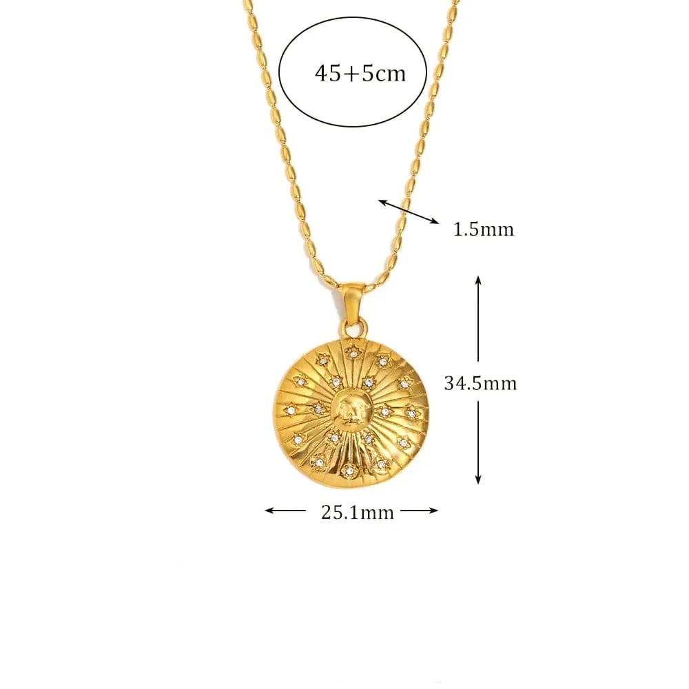 Gold necklace with pendant, showing measurements and material details on a white background