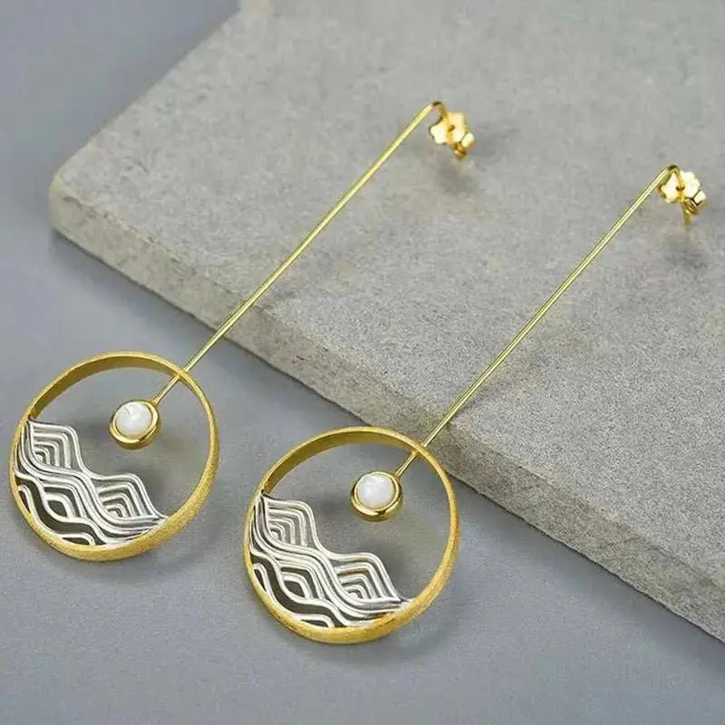 long gold earrings moonstone waves