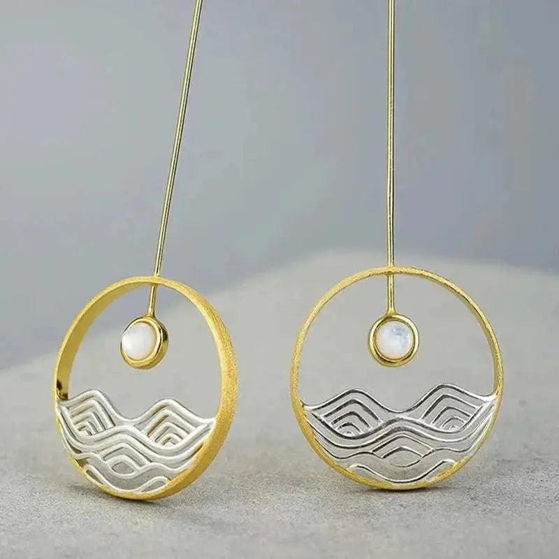 moonstone waves long gold earrings