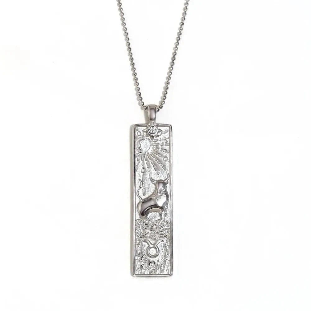 Silver pendant necklace with intricate design on a white background